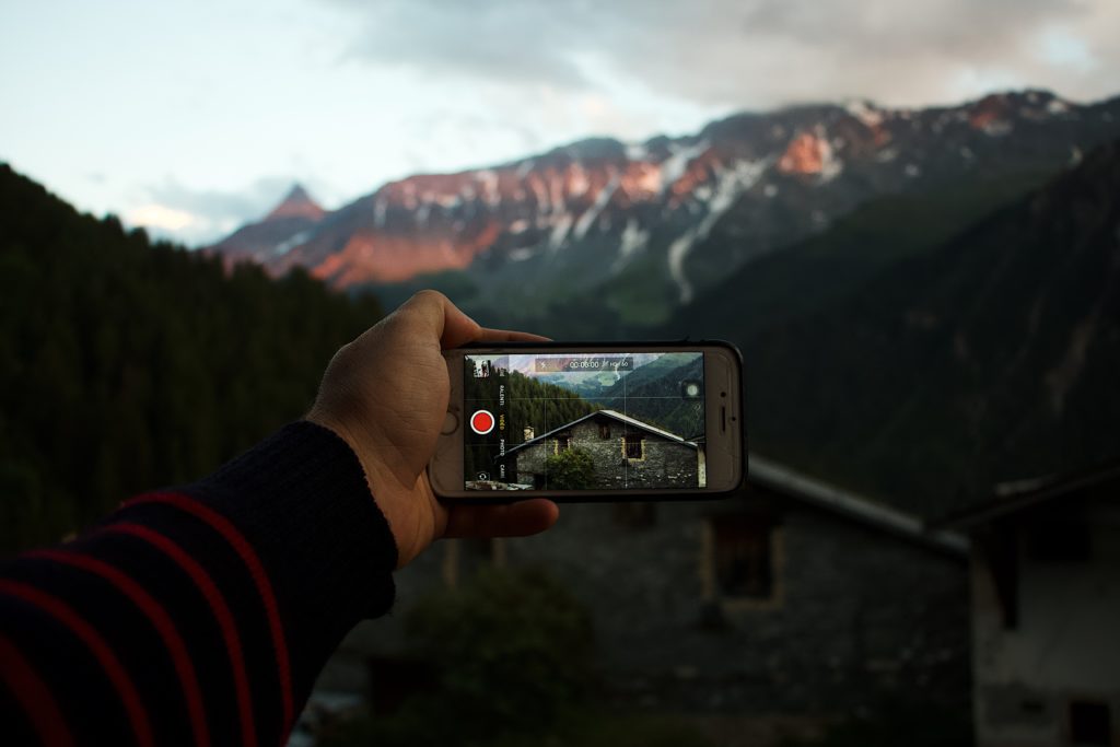 Taking a photo of mountains over in iphone.