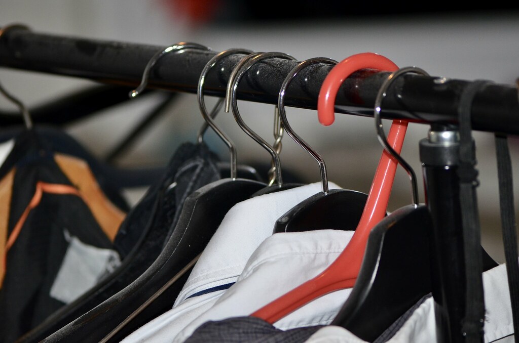 Shirts hanging on different clothes hangers