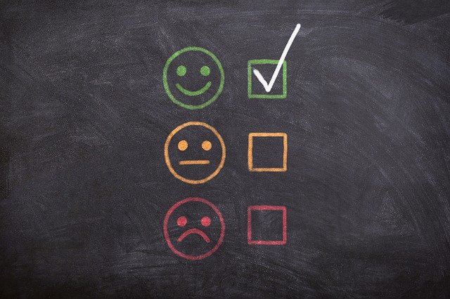Three faces with boxes next to them. One happy, one neutral, one frown. The box next to the happy face is checked.