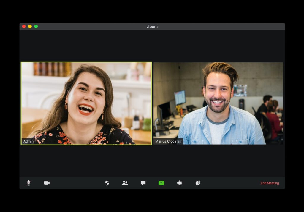 a woman and man connecting and laughing in a private online conversation