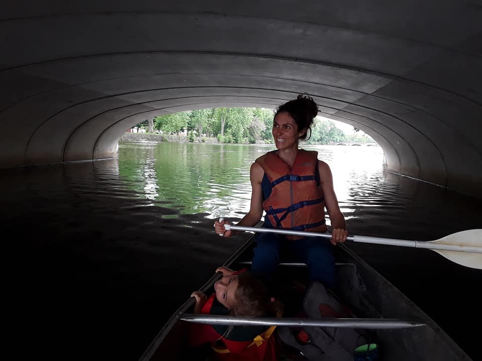 Canoeing under a bridge