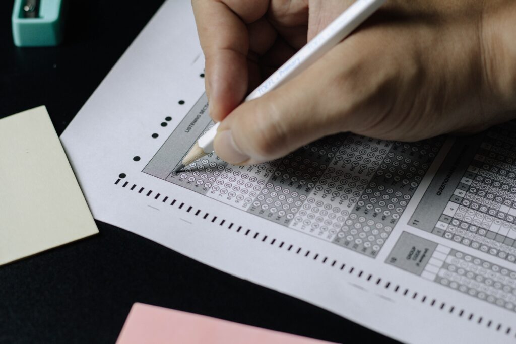 a student taking a test on an old scantron paper