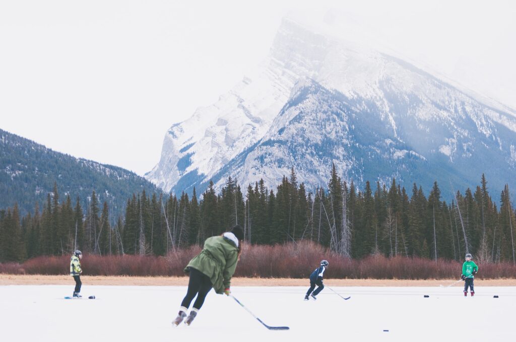 people playing hockey outdoors