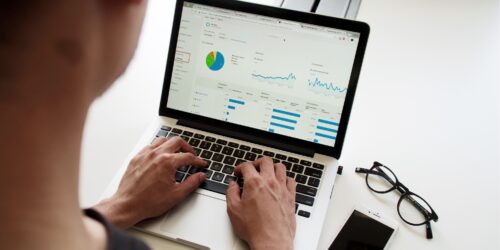 A person using spreadsheets to build charts.