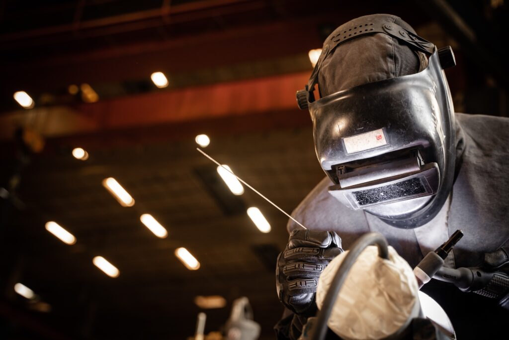 A person is welding in a weld shop