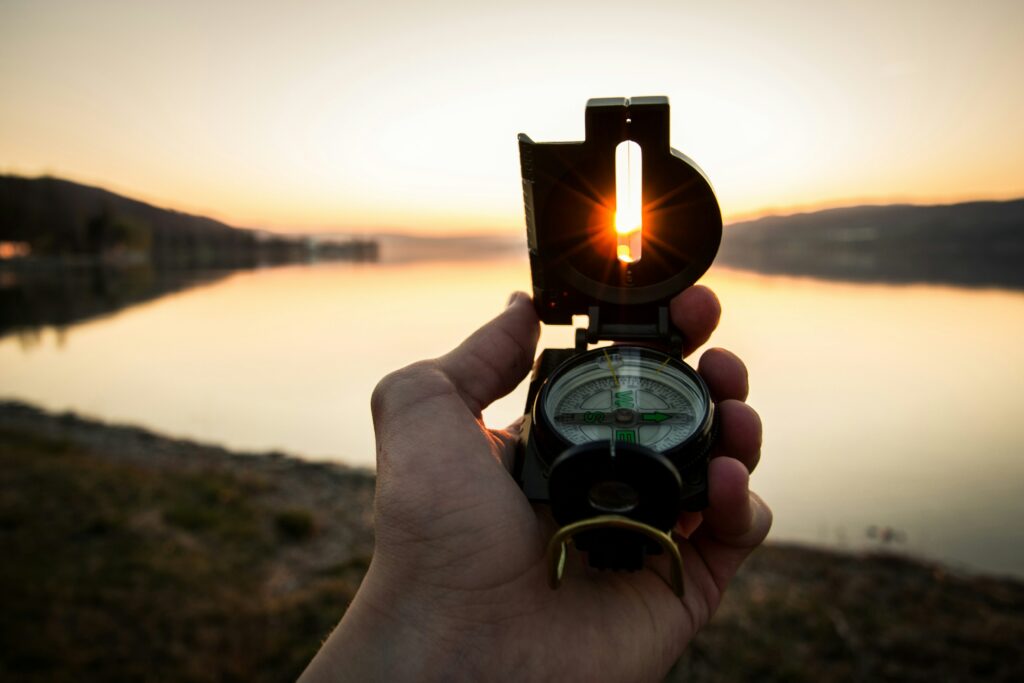 Picture of hand holding a compass