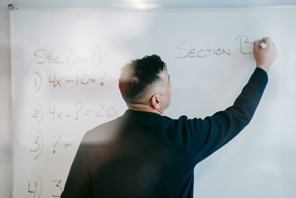 Man writing on whiteboard